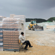 A worker takes a cigarette break.
